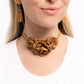 Light brown satin petals form into a decadent trio of rosettes atop a sleek satin ribbon in the same hue along the collar for a whimsical display. Features an adjustable clasp closure.  Sold as one individual choker necklace. Includes one pair of matching earrings.