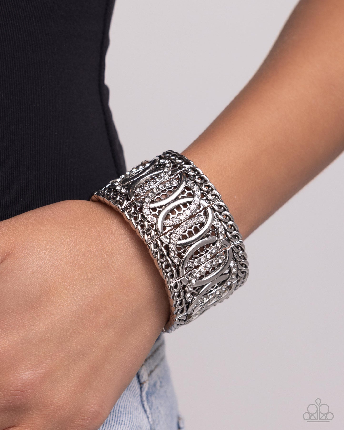 Paparazzi Accessories - Forged Fashion - White Bracelets infused along elastic stretchy bands, a collection of silver chain borders along silver rings that alternate with white rhinestone-encrusted rings for a monochromatic look along the wrist.  Sold as one individual bracelet.