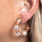 Gradually increasing in size at the center, a classic row of pearls with a subtle iridescent coating are threaded along a silver wire hoop, alternating with chiseled shiny copper metallic beads for a playfully posh look. Earring attaches to a standard post fitting. Hoop measures approximately 1 1/2" in diameter. Due to its prismatic palette, color may vary.  Sold as one pair of hoop earrings.