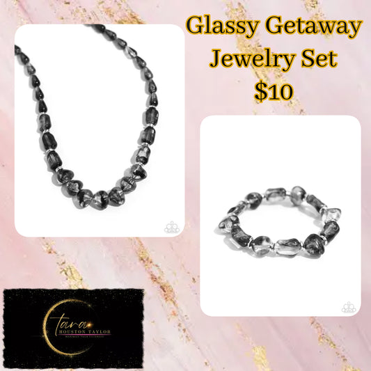 <p>Paparazzi Accessories- Glassy Getaway - Black Jewelry Set featuring a glassy opacity, smoky beads in various shapes are infused along the neckline for a stylish statement. Silver discs are sporadically inserted throughout the glassy beads for a touch of sheen. Features an adjustable clasp closure.</p> <p><i>Sold as one individual necklace. Includes one pair of matching earrings.</i></p>