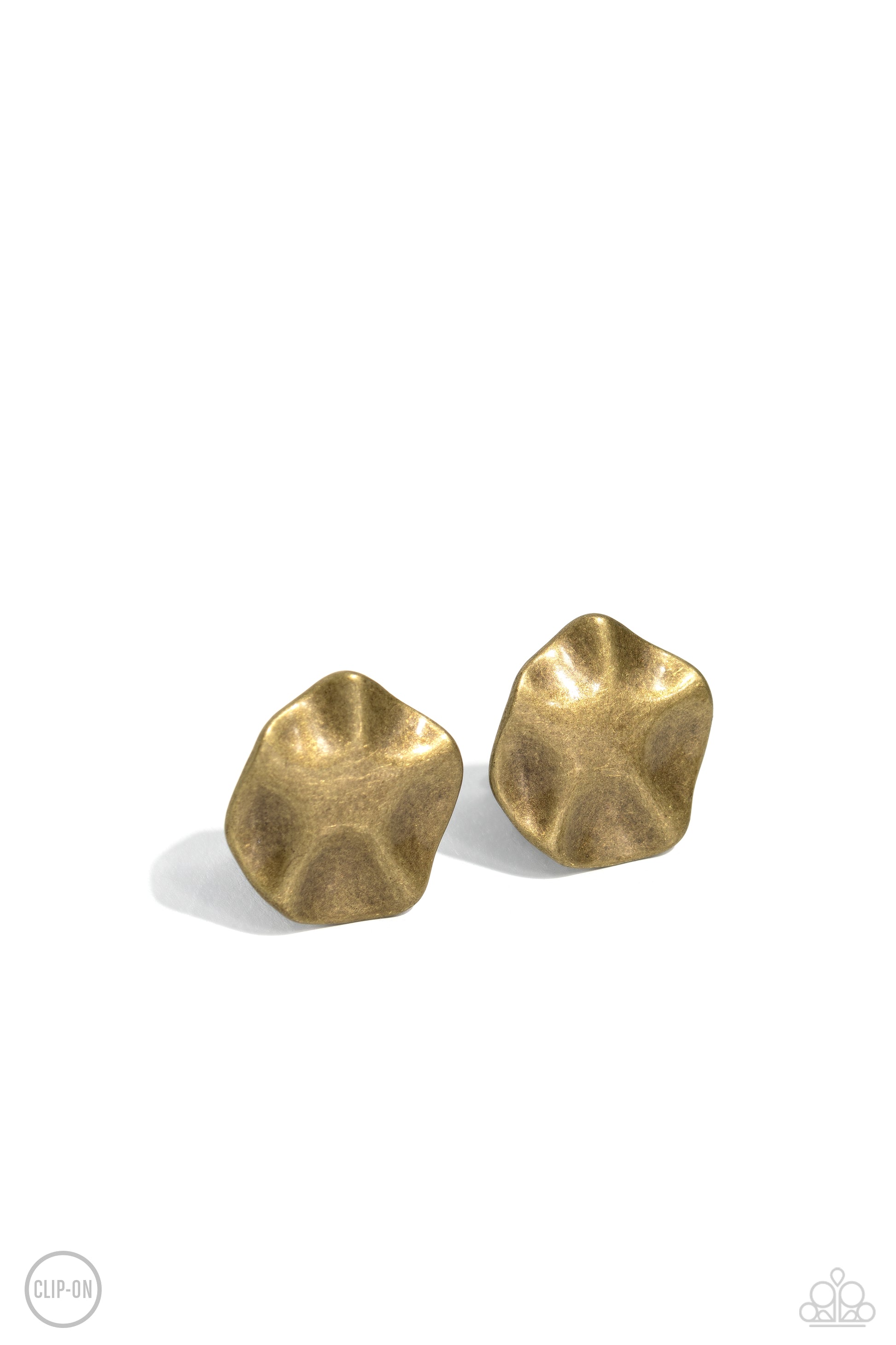 Featuring a high sheen finish, wavy brass discs are hammered and molded into a rustic industrial statement. Earring attaches to a standard clip-on fitting.  Sold as one pair of clip-on earrings.