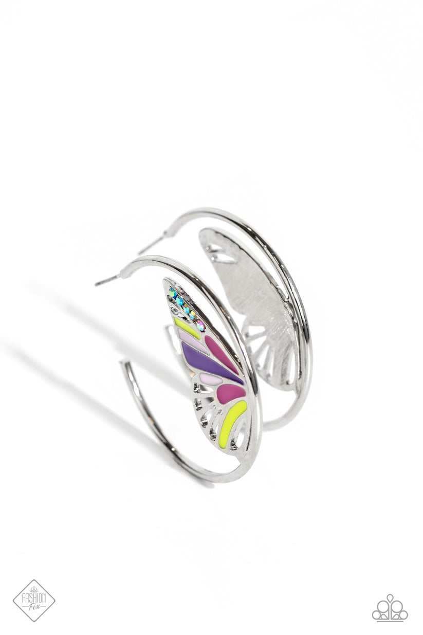 An oversized silver butterfly wing, splashed with baby pink, Fuchsia Fedora, Love Bird, and multicolored iridescent rhinestones, nestles along the inner curve of a glistening silver hoop, creating a whimsically colorful sight. Earring attaches to a standard post fitting. Hoop measures approximately 1 3/4" in diameter. Due to its prismatic palette, color may vary.  Sold as one pair of hoop earrings.