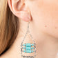 Rows of cylindrical silver and turquoise stone beads are threaded along metal rods between faceted silver cubes. Silver rods stream out from the bottom of the stacked display, resulting in an earthy fringe. Earring attaches to a standard fishhook fitting.  Sold as one pair of earrings.