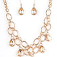Show-Stopping Shimmer - Gold Link Necklaces joined by dainty gold links, two rows of dramatic gold chain layer below the collar in a fierce fashion. Golden teardrops drip from the glistening layers, adding a timeless shimmer to the show-stopping piece. Features an adjustable clasp closure.  Sold as one individual necklace. Includes one pair of matching earrings.