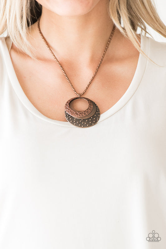 Texture Trio - Copper Texture Necklaces rippling in textures derived from nature, mismatched copper hoops swing from the bottom of a lengthened copper chain for a tribal inspired look. Features an adjustable clasp closure.
