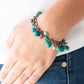 Paparazzi Accessories Hold My Drink - Green Bracelets pearly and polished green beading joins faceted gunmetal beads along a bold gunmetal chain, creating a sassy fringe around the wrist. Features an adjustable clasp closure.  Sold as one individual bracelet.  Get The Complete Look! Necklace: "Watch Me Now - Green" (Sold Separately)   