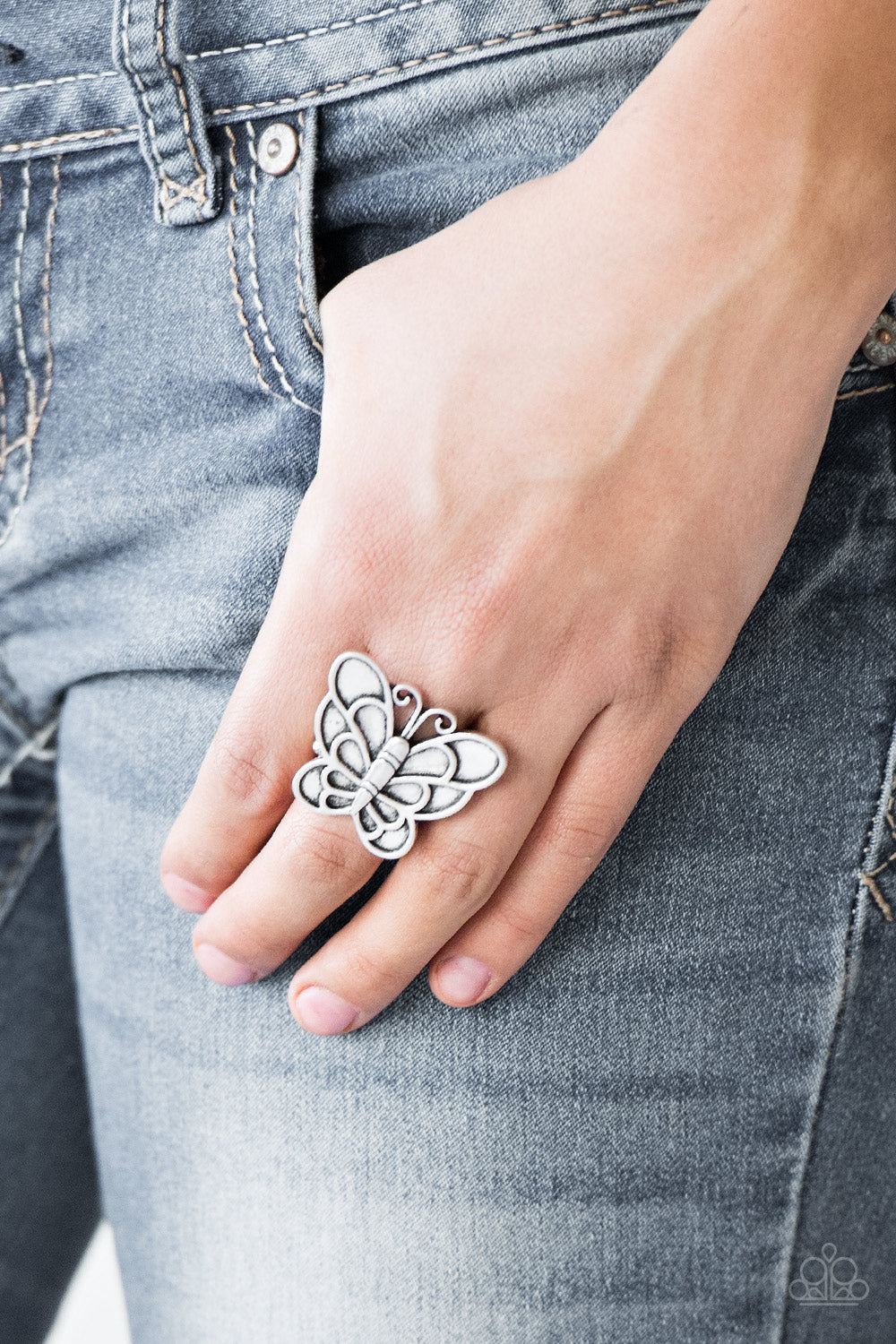 Sky High Butterfly - Silver Rings brushed in an antiqued finish, a dramatic silver butterfly blooms across the finger for a whimsical look. Features a stretchy band for a flexible fit.  Sold as one individual ring.