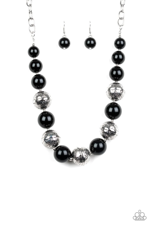 Paparazzi Accessories - Floral Fusion - Black Necklace infused with dainty silver accents, a bubbly collection of shiny black beads and floral embossed silver beads are threaded along an invisible wire below the collar for a seasonal look. Features an adjustable clasp closure. Sold as one individual necklace. Includes one pair of matching earrings.