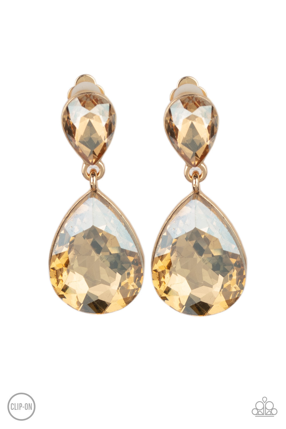 Paparazzi Accessories Aim For the MEGASTARS - Gold Clip-On Earrings dramatically oversized golden rhinestone teardrop swings from the bottom of a smaller rhinestone teardrop, linking into a glamorous lure. Earring attaches to a standard clip-on fitting.  Sold as one pair of clip-on earrings.