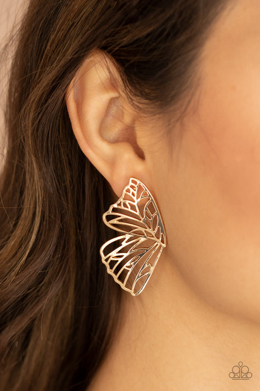 Butterfly Frills - Gold Post Earrings shimmery gold bars delicately climb scalloped gold frames, coalescing into a whimsical butterfly wing. Earring attaches to a standard post itting.  Sold as one pair of double-sided post earrings.  Paparazzi Jewelry is lead and nickel free so it's perfect for sensitive skin too!