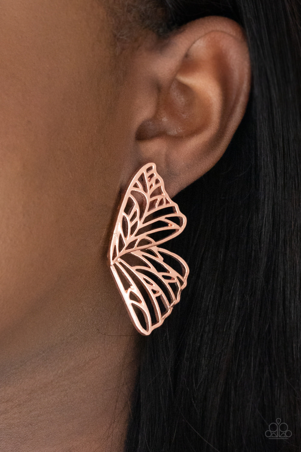 Butterfly Frills - Copper Earrings shiny copper bars delicately climb scalloped shiny copper frames, coalescing into a whimsical butterfly wing. Earring attaches to a standard post fitting.  Sold as one pair of post earrings.  Paparazzi Jewelry is lead and nickel free so it's perfect for sensitive skin too!