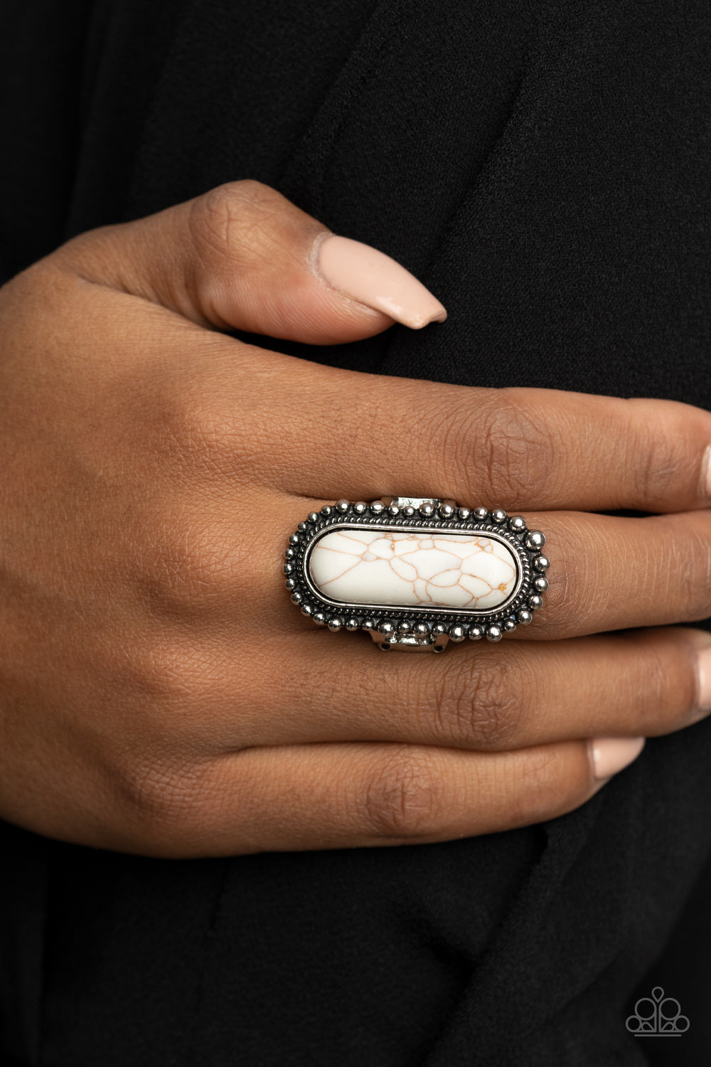 Paparazzi Accessories Sedona Scene - White Rings an oblong white stone is nestled inside an oversized studded silver frame, creating a colorfully rustic centerpiece atop the finger. Features a stretchy band for a flexible fit.