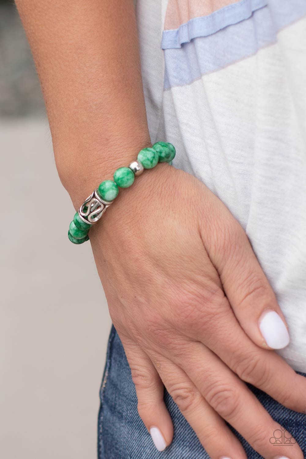 Soothes the Soul - Green Urban Bracelets infused with an ornate silver centerpiece, an earthy collection of silver and jade beads are threaded along a stretchy band around the wrist for a seasonal flair.  Sold as one individual bracelet.  Paparazzi Jewelry is lead and nickel free so it's perfect for sensitive skin too!
