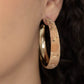 Paparazzi Accessories - A Cork in the Road - Gold Hoop Earrings golden veins accent the front of a cork lined gold hoop, creating a refined display. Hoop measures approximately 2" in diameter. Earring attaches to a standard post fitting.  Sold as one pair of hoop earrings.