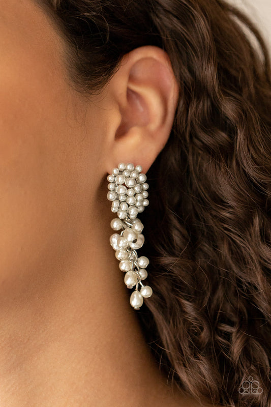 Fabulously Flattering - White Earrings featuring imperfect finishes, a bubbly tassel of white pearls trickles from the bottom of a pearl encrusted silver fitting for a timeless look. Earring attaches to a standard post fitting.  Sold as one pair of post earrings.  Paparazzi Jewelry is lead and nickel free so it's perfect for sensitive skin too!