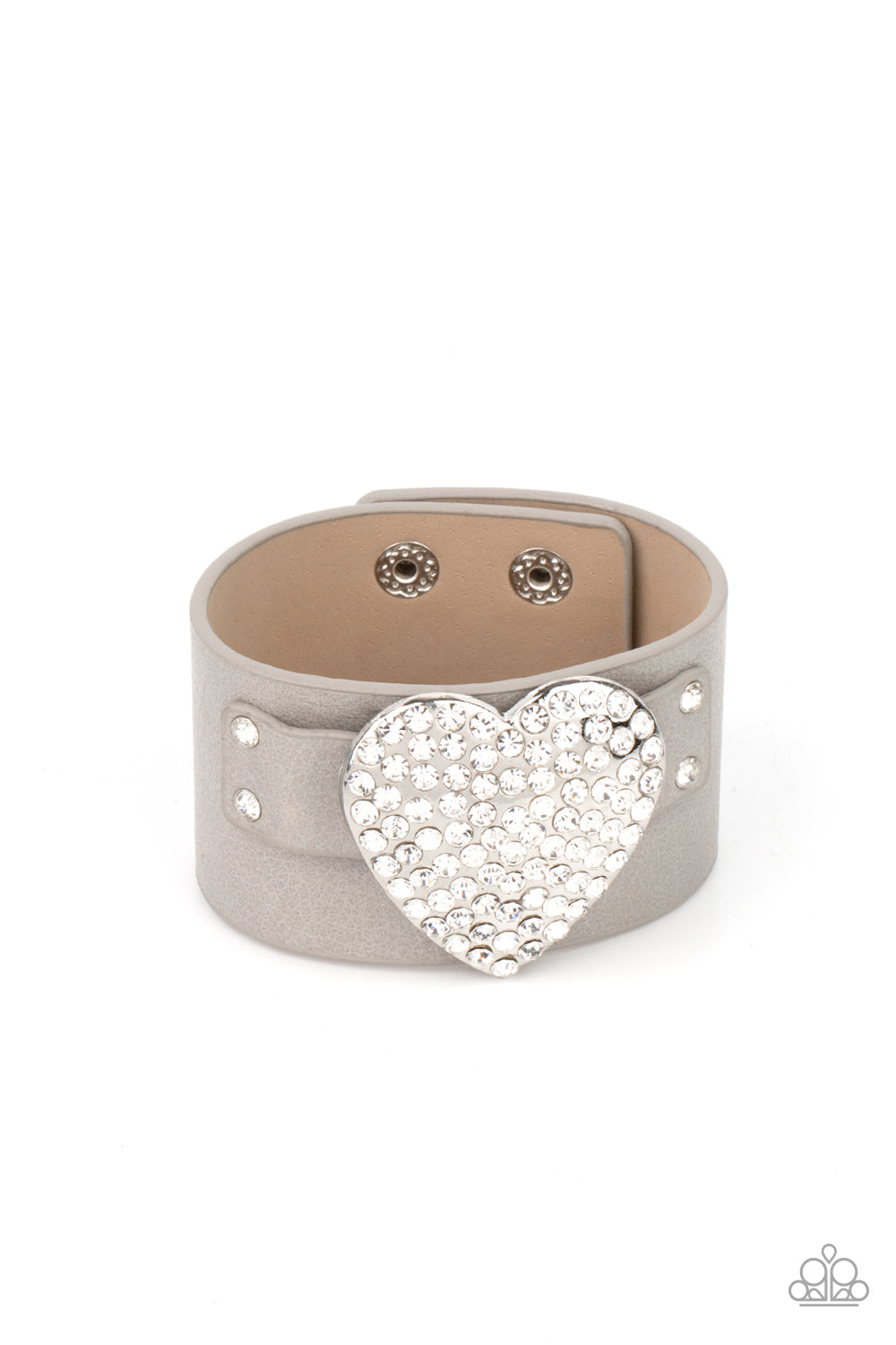 Flauntable Flirt - Silver Bracelets encrusted in blinding white rhinestones, an oversized silver heart frame is studded in place across the front of a gray leather band, creating a flirtatious centerpiece around the wrist. Features an adjustable snap closure.  Sold as one individual bracelet.  Paparazzi Jewelry is lead and nickel free so it's perfect for sensitive skin too!