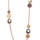 Gallery Guru - Copper Long Necklaces a hammered collection of gold and copper discs and asymmetrical rings link with sections of rustic copper chain across the chest, creating a casual display. Features an adjustable clasp closure.  Sold as one individual necklace. Includes one pair of matching earrings.  Paparazzi Jewelry is lead and nickel free so it's perfect for sensitive skin too!