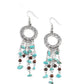 Paparazzi Accessories Primal Prestige - Blue Fishhook Earrings tapered tassels of dainty wooden beads and turquoise pebbles stream from the bottom of a hammered silver hoop, creating an earthy fringe. Earring attaches to a standard fishhook fitting.