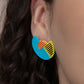 Paparazzi Accessories It's Just an Expression - Blue Post Earrings featuring airy stenciled linear patterns, overlapping blue and yellow crescent shaped frames gather around a dainty orange crescent frame, creating a modern display. Earring attaches to a standard post fitting.
