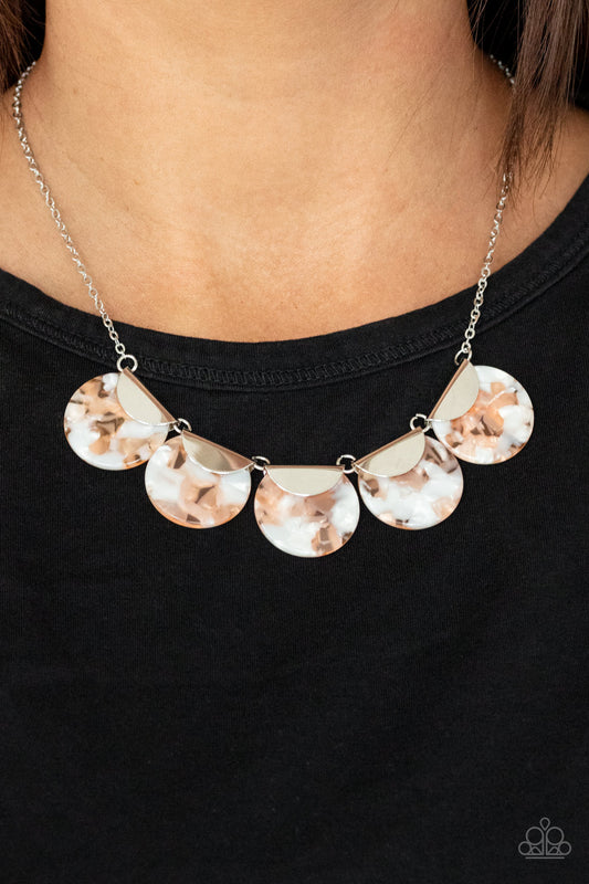 Mermaid Oasis - Orange Shell-Like Necklaces flecked in shell-like iridescence, orange acrylic discs are pinched between shiny silver fittings as they link below the collar, creating a colorful fringe. Features an adjustable clasp closure.  Sold as one individual necklace. Includes one pair of matching earrings.
