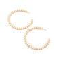 Should Have, Could Have, WOOD Have - White Wood Hoop Earrings white wooden beads are threaded along a dainty wire, creating an earthy hoop. Earring attaches to a standard post fitting. Hoop measures approximately 2 1/2" in diameter.  Sold as one pair of hoop earrings.
