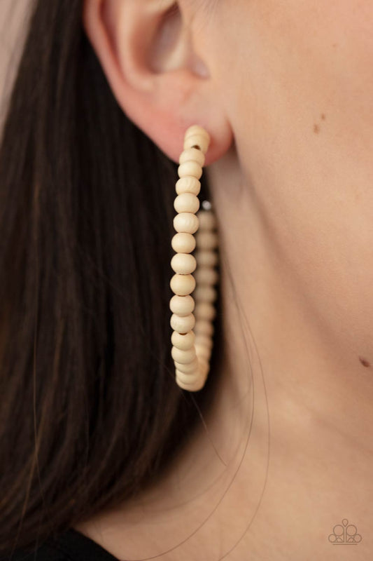 Should Have, Could Have, WOOD Have - White Wood Hoop Earrings white wooden beads are threaded along a dainty wire, creating an earthy hoop. Earring attaches to a standard post fitting. Hoop measures approximately 2 1/2" in diameter.  Sold as one pair of hoop earrings.