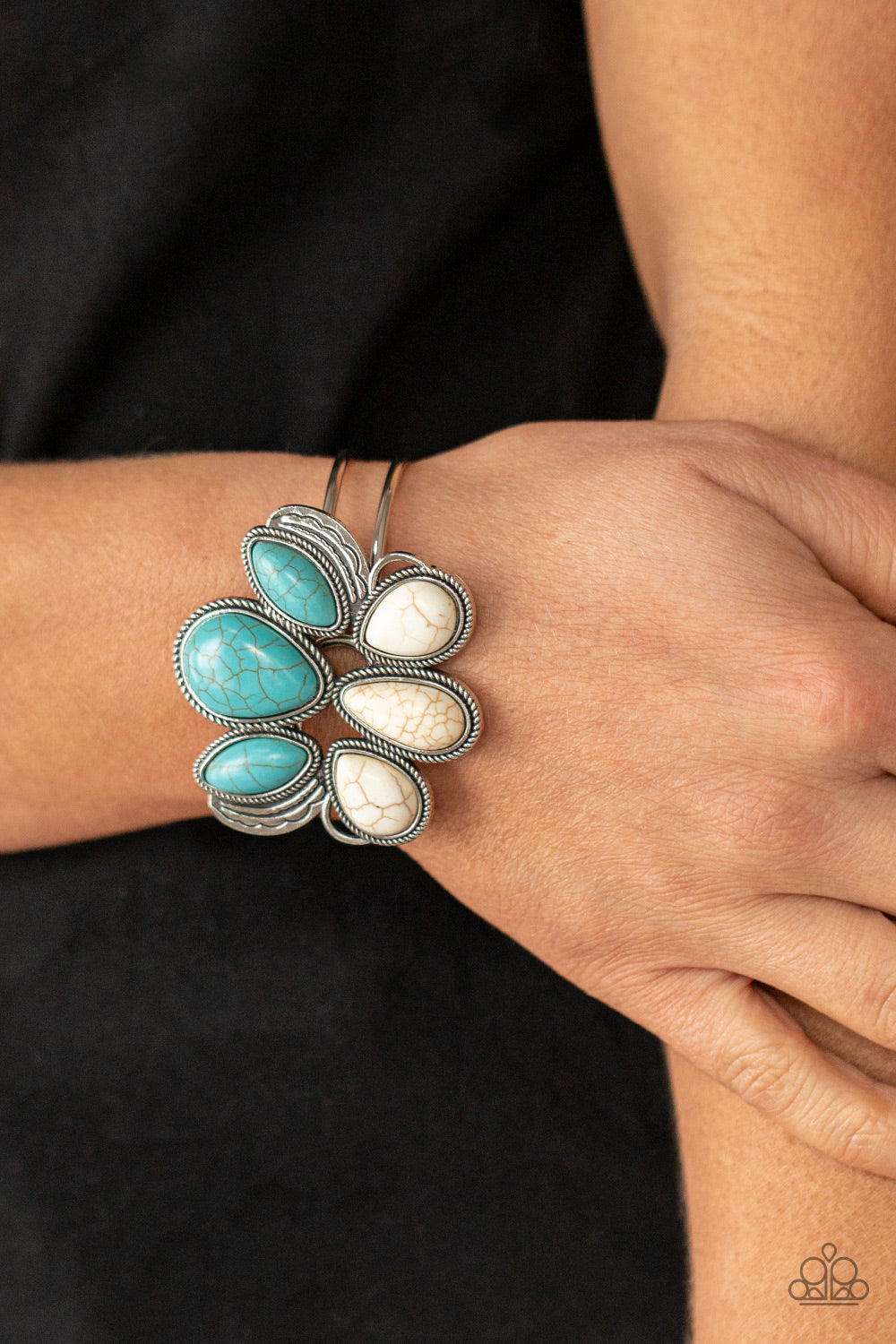 Paparazzi Accessories Botanical Badlands - White Bracelets encased in rope-like silver accents, a series of oversized oval and teardrop turquoise and white stone frames stack into a lotus-like floral frame atop a layered silver cuff. Features a hinged closure.  Sold as one individual bracelet.  Paparazzi Jewelry is lead and nickel free so it's perfect for sensitive skin too!