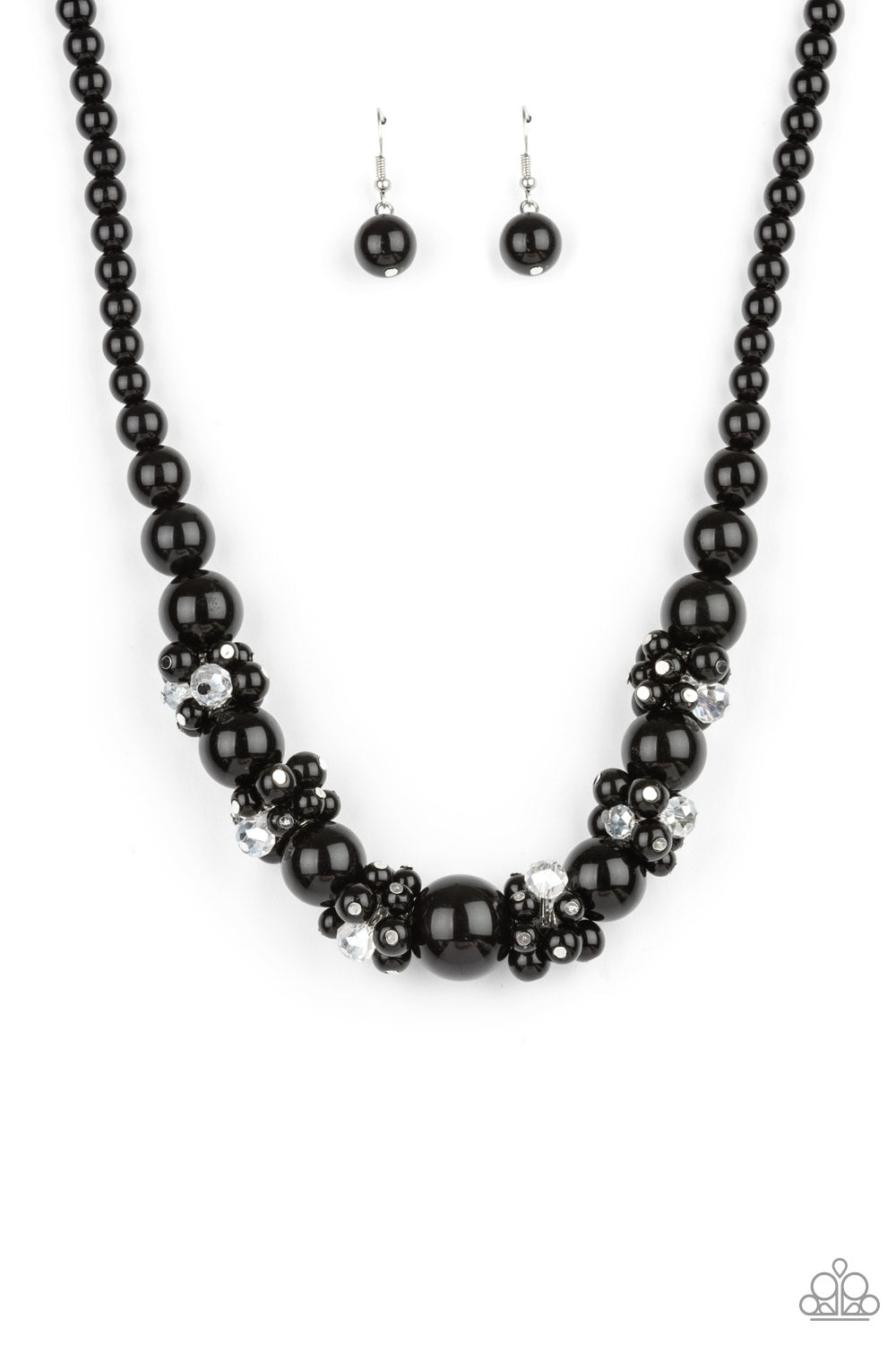 All Dolled UPSCALE - Black Necklaces dainty black beads and sparkly white crystal-like beads cluster between oversized black beads that are threaded along an invisible wire below the collar, creating a stunning centerpiece. Features an adjustable clasp closure.  Sold as one individual necklace. Includes one pair of matching earrings.