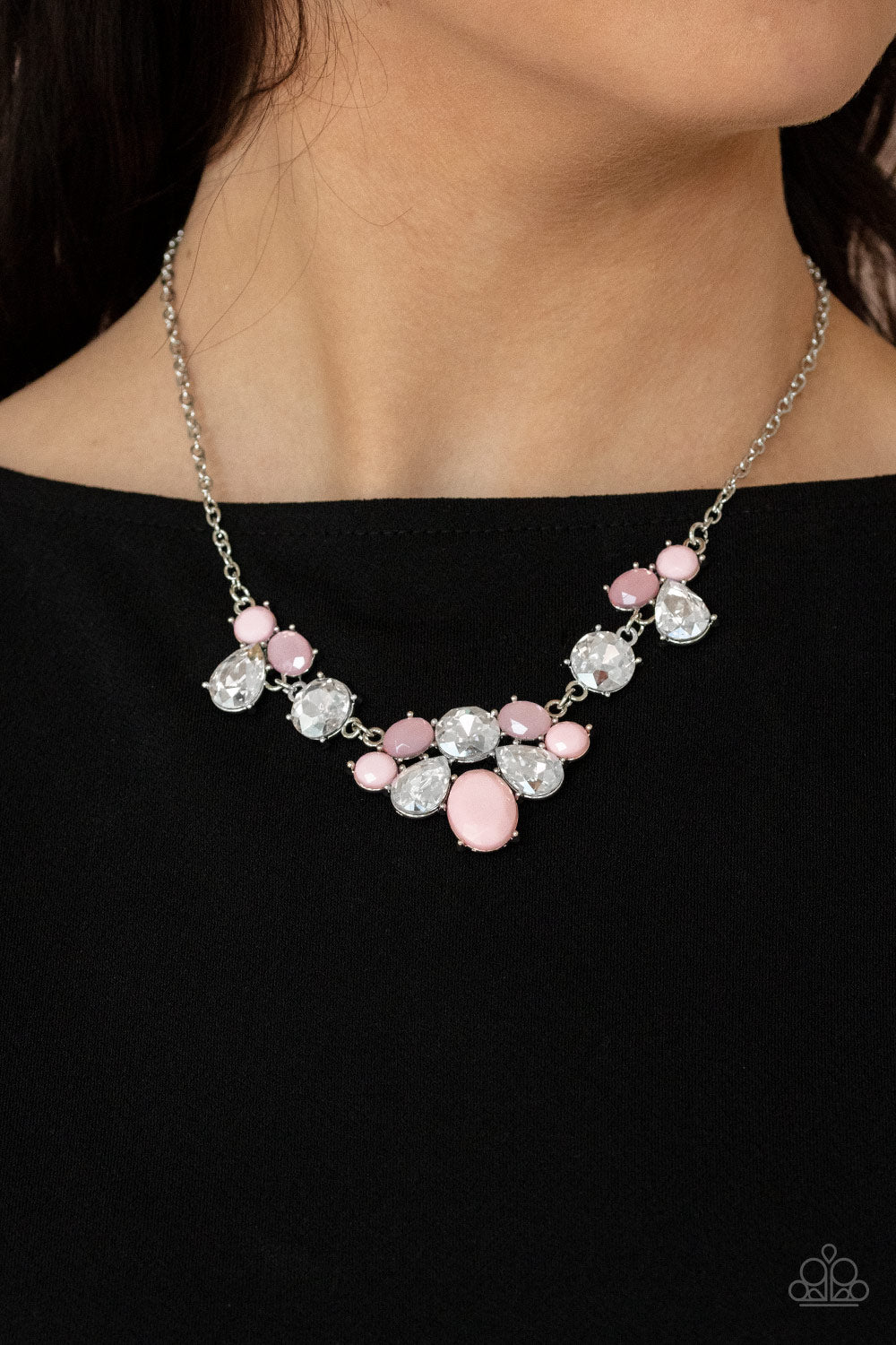 Paparazzi Accessories Ethereal Romance - Pink Necklaces varying in opacity and shape, mismatched pink beads attach to oversized white rhinestones, creating bubbly frames that delicately link into an ethereal display below the collar. Features an adjustable clasp closure.  Sold as one individual necklace. Includes one pair of matching earrings.  Paparazzi Jewelry is lead and nickel free so it's perfect for sensitive skin too!