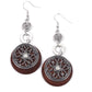 Paparazzi Accessories Royal Marina - Brown Fishhook Earrings reminiscent of an eclipse, an airy silver ring radiating with ornate petals, sways in front of a brown shell-like disc. Silver rings in graduating sizes cascade from the top for a whimsically nautical look. Earring attaches to a standard fishhook fitting.  Sold as one pair of earrings.
