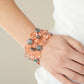 Crystal Charisma - Orange Stretch Bracelet a mismatched collection of sparkly Burnt Coral crystal-like beads and textured silver accents are threaded along stretchy bands around the wrist, creating glamorous layers.  Silver accent and pink clear bead strands stack together in three to make this feminine piece.
