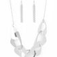 Guide to the Galaxy - Silver Triangular Necklaces - Paparazzi Accessories large triangular cutouts stamped in a lightly dotted texture link below the collar forming a dramatic display of silver slices. Features an adjustable clasp closure.  Sold as one individual necklace. Includes one pair of matching earrings.