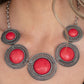 She Went West - Red Stone Necklaces - Paparazzi Accessories bright red stones, pressed into round antiqued silver frames featuring dot and interlinking loop motifs, create a dramatically rustic statement as they link across the collar. Features an adjustable clasp closure.