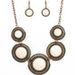 She Went West - Brass Frame White Stone Necklaces earthy white stones, pressed into round antiqued brass frames featuring dot and interlinking loop motifs, create a dramatically rustic statement as they link across the collar. Features an adjustable clasp closure.  Sold as one individual necklace. Includes one pair of matching earrings.  Paparazzi Jewelry is lead and nickel free so it's perfect for sensitive skin too!
