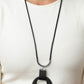 Luxe Crush - Black Leather Disc Necklaces a large cutout silver disc, overlaid with black leather, is cradled in a wide black leather strap. The luxe pendant sways from a U-shaped silver cylinder threaded along the end of a lengthened polished black cord for an indulgently lavish finish. Features a sliding bead closure.  Sold as one individual necklace. Includes one pair of matching earrings.  Paparazzi Jewelry is lead and nickel free so it's perfect for sensitive skin too!