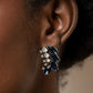 Flawless Fronds - Blue Rhinestone Post Earrings - Paparazzi Accessories a frond of dazzling blue marquise and round white rhinestones delicately curves below the ear for a flawless finish. Earring attaches to a standard post fitting.  Sold as one pair of post earrings.