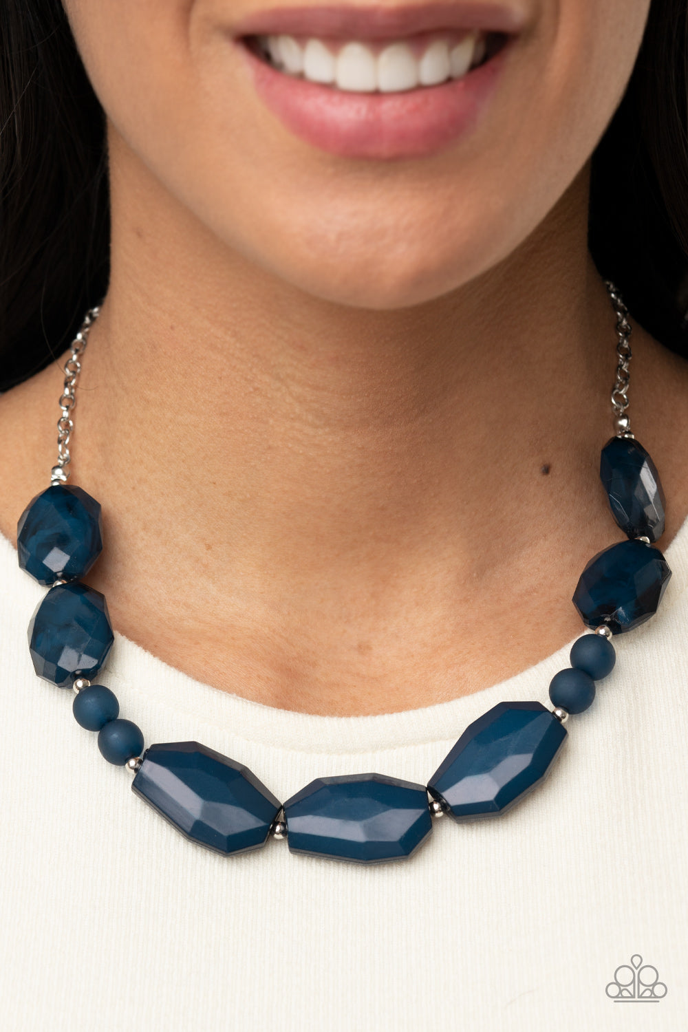 Melrose Melody - Blue Faceted Bead Necklaces - Paparazzi a series of opaque and cloudy faceted Navy Blue gem-like beads are threaded along an invisible wire. Dainty silver beads add shining accents as they traverse across the collar on a silver chain in a classically melodic display. Features an adjustable clasp closure.  Sold as one individual necklace. Includes one pair of matching earrings.  Paparazzi Jewelry is lead and nickel free so it's perfect for sensitive skin too!