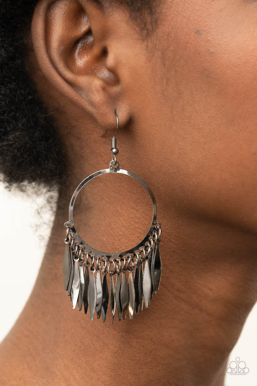 Radiant Chimes - Black Gunmetal Fringe Earrings flared flat bars stream out from the bottom of a glistening gunmetal hoop, creating a radiant fringe. Earring attaches to a standard fishhook fitting.  Sold as one pair of earrings.  Paparazzi Jewelry is lead and nickel free so it's perfect for sensitive skin too!