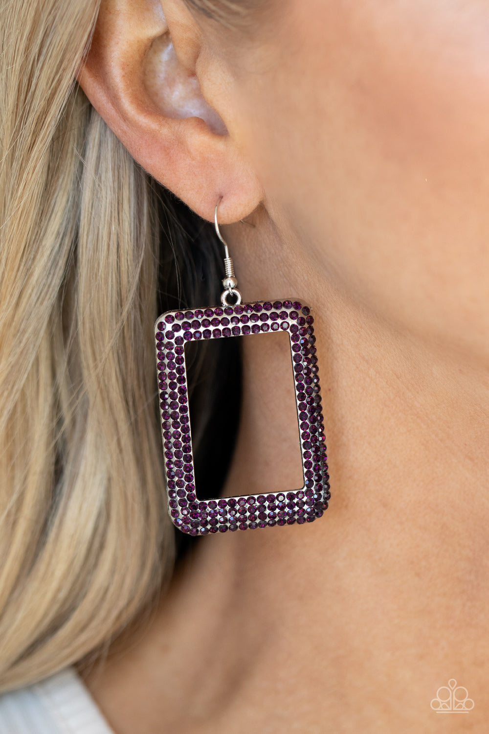 Paparazzi Accessories World FRAME-ous - Purple Fishhook Earrings bordered in rows of glittery purple rhinestones, an oversized silver rectangular frame swings from the ear for a fashionable finish. Earring attaches to a standard fishhook fitting. 