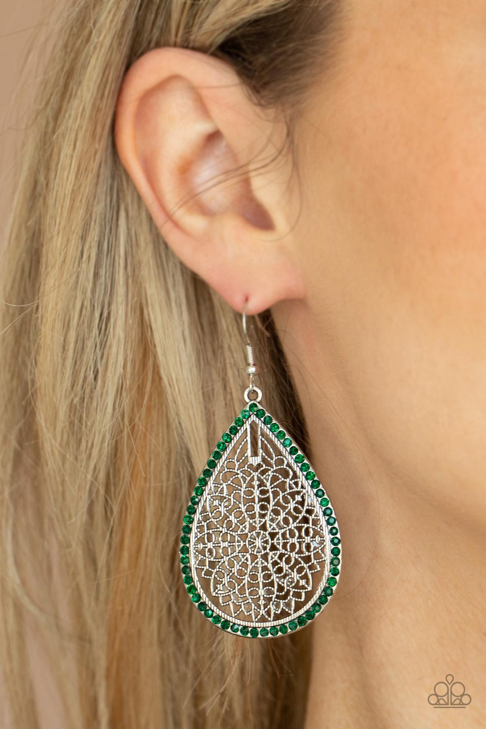 Fleur de Fantasy - Green Fishhook Earrings bordered in dainty green rhinestones, the center of an oversized silver teardrop is filled with an airy floral pattern for a seasonal flair. Earring attaches to a standard fishhook fitting.
Sold as one pair of earrings.
Paparazzi Jewelry is lead and nickel free so it's perfect for sensitive skin too!
