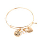 Come What May and Love It - Gold Charm Bracelet - Paparazzi infused with a shiny gold heart frame, a dainty gold disc stamped in the phrase, "Come what may and love it," joins pearl, crystal, and rhinestone charms along a bangle-like bracelet for a whimsy look. Features a toggle closure.  Sold as one individual bracelet.  Paparazzi Jewelry is lead and nickel free so it's perfect for sensitive skin too!