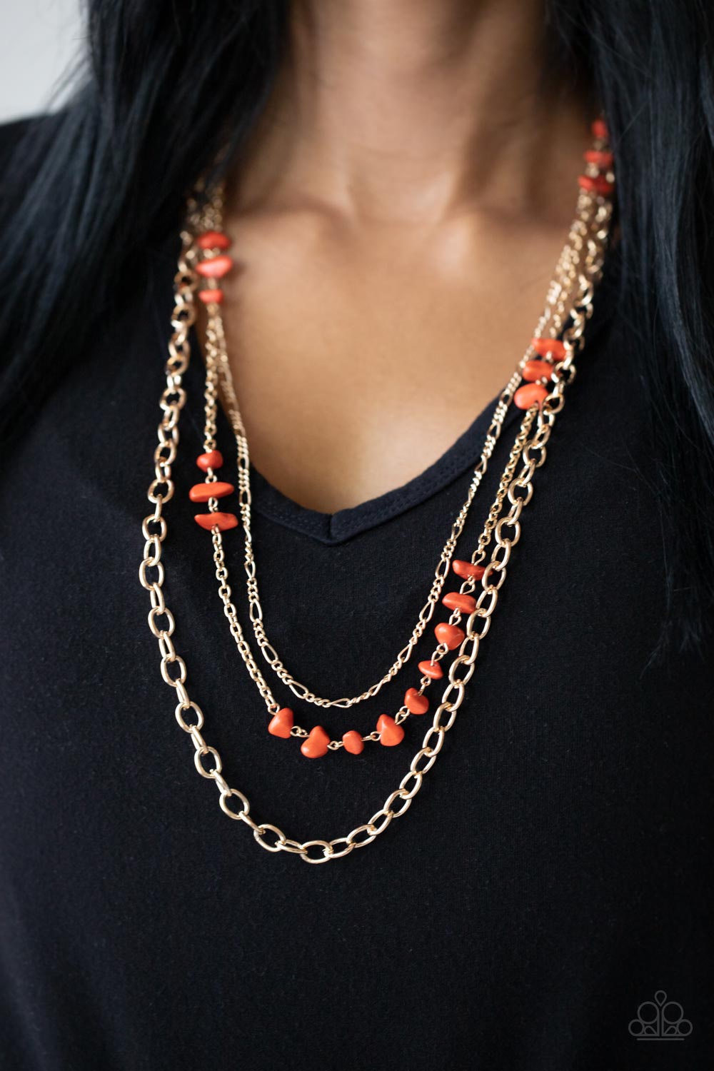Artisinal Abundance - Orange Stone Necklaces infused with sections of refreshing orange stones, a trio of mismatched gold chains layer down the chest for a dash of earthy refinement. Features an adjustable clasp closure.  Sold as one individual necklace. Includes one pair of matching earrings.