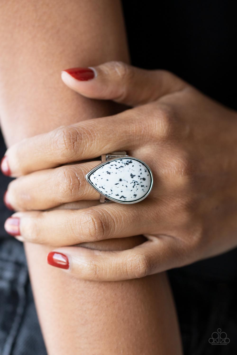 Paparazzi Stormy Sunrise - White Stone Ring a generous polished white stone infused with black flecks is encased in a simple silver teardrop frame resulting in a seasonal finish atop the finger. Features a stretchy band for a flexible fit.  Sold as one individual ring.