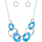 Urban Circus - Blue Acrylic Necklaces an asymmetrical assortment of neon blue acrylic rings and hammered silver hoops boldly interlock below the collar, creating an intense pop of color. Features an adjustable clasp closure.