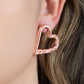 Cupid Who? - Copper Heart Earrings - Paparazzi Accessories one side of a shiny copper heart frame is subtlety twisted with twinkly texture, creating a romantic display. Earring attaches to a standard post fitting. Sold as one pair of post earrings.  Paparazzi Jewelry is lead and nickel free so it's perfect for sensitive skin too!