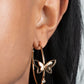 Full Out Flutter - Gold Butterfly Hoop Earrings  a pair of dainty gold butterflies flutter atop a glistening gold hoop dotted with dainty white rhinestones, creating a whimsical sight. Earring attaches to a standard post fitting. Hoop measures approximately 1 1/2" in diameter.  Sold as one pair of hoop earrings.
