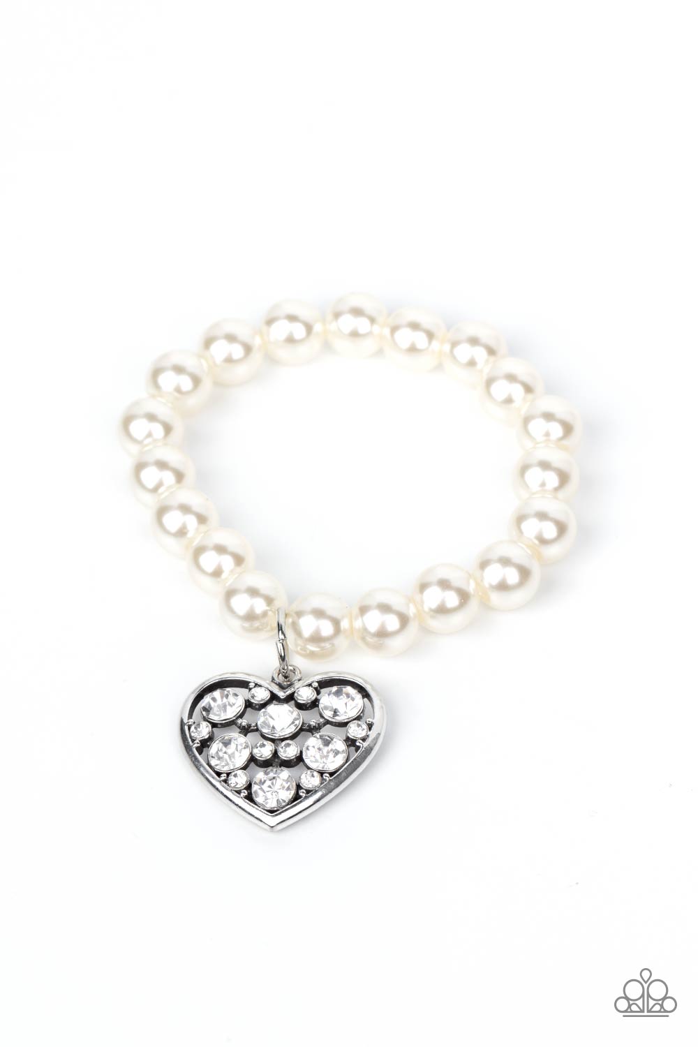 Cutely Crushing - White Pearl Heart Bracelets - Paparazzi dramatically oversized white rhinestone encrusted silver heart charm dangles from a stretchy strand of bubbly white pearls, creating a flirtatious dazzle.  Sold as one individual bracelet.  Paparazzi Jewelry is lead and nickel free so it's perfect for sensitive skin too!