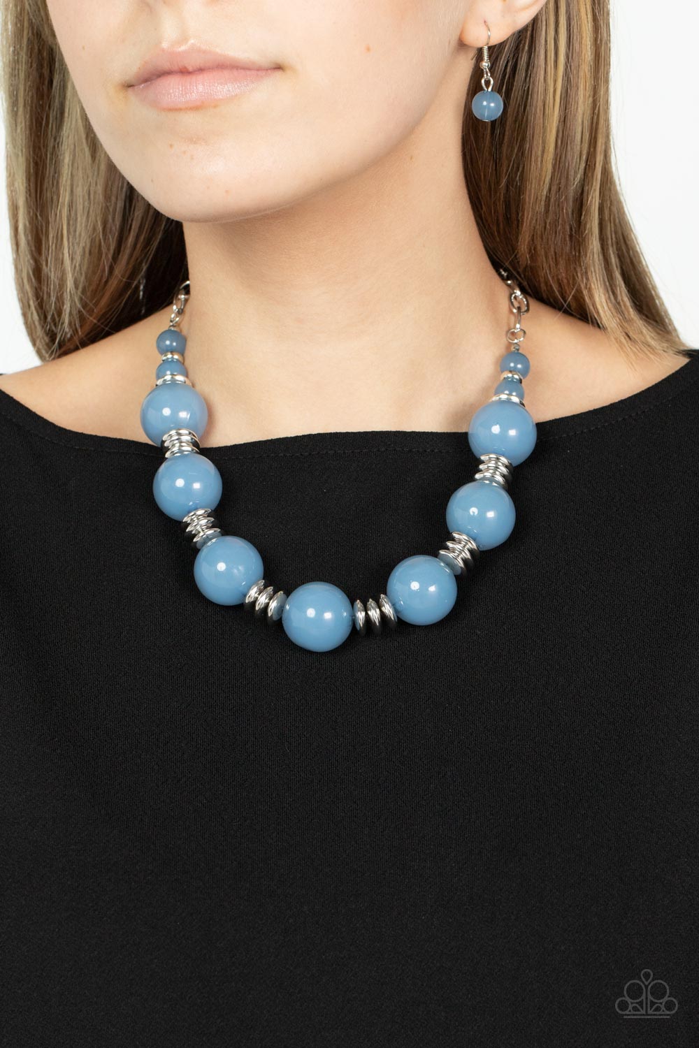 Paparazzi Accessories - Race to the Pop - Blue Necklaces an oversized collection of glassy Spring Lake beads and shiny silver discs are threaded along an invisible wire, creating a dramatic pop of color below the collar. Features an adjustable clasp closure.  Sold as one individual necklace. Includes one pair of matching earrings.