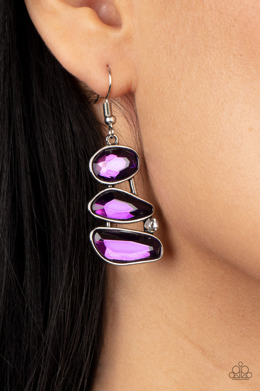 Paparazzi Accessories - Gem Galaxy - Purple Earrings infused with a solitaire white rhinestone, an asymmetrical series of purple gems delicately stack into an out-of-this-world centerpiece. Earring attaches to a standard fishhook fitting.  Sold as one pair of earrings.