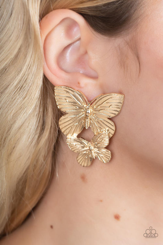 Blushing Butterflies - Gold Textured Earrings Veined with lifelike textures, a pair of golden butterflies flutters from the ear for a whimsical fashion. Earring attaches to a standard post fitting.  Sold as one pair of post earrings.